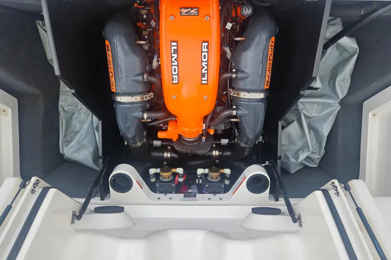 Slide: The Image of 2016 MasterCraft X23 boat engine, featuring an orange Ilmor motor. - 5