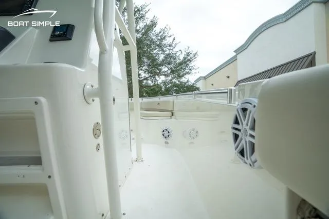 Slide: The Image of 2023 Cobia 240 Center Console boat interior with speakers and seating area. - 11