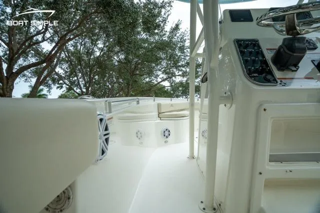 Slide: The Image of 2023 Cobia 240 Center Console boat interior with steering console and seating area. - 12