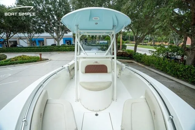 Slide: The Image of 2023 Cobia 240 Center Console boat with spacious seating and sleek design. - 21