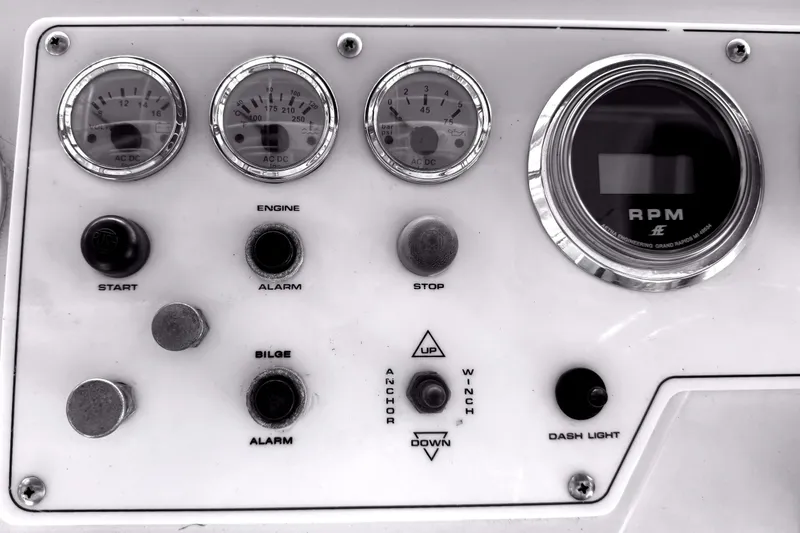 Slide: The Image of Control panel of a 1996 Riviera 39 Open Flybridge with gauges and switches. - 11