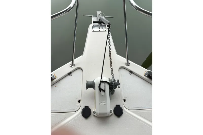 Slide: The Image of Bow of 1996 Riviera 39 Open Flybridge with anchor chain and winch system. - 15