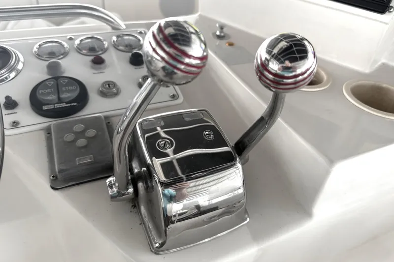Slide: The Image of Close-up of 1996 Riviera 39 Open Flybridge boat controls and dashboard. - 8