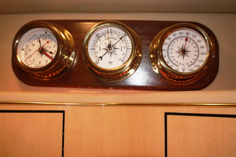 Slide: The Image of Nautical gauges on a 1999 Sea Ray 460 Sundancer boat interior. - 28