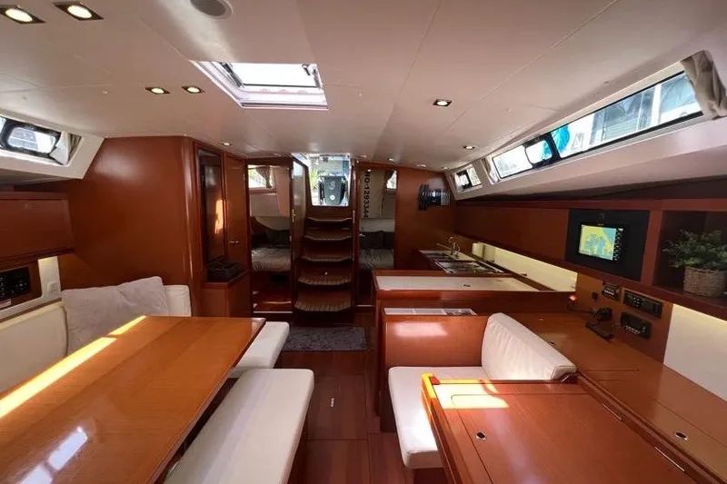 Slide: The Image of Luxurious interior of 2013 Beneteau Oceanis 45 yacht with wood finish and modern amenities. - 17