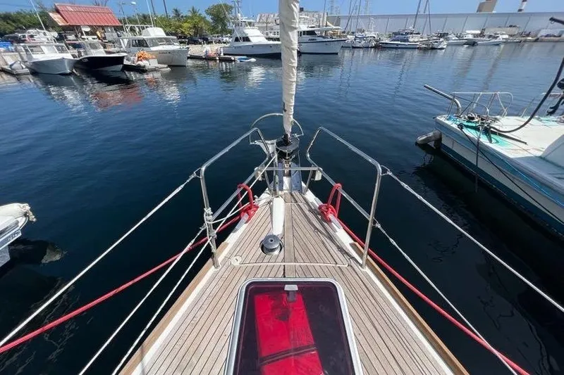 Slide: The Image of Bow view of 2013 Beneteau Oceanis 45 sailboat docked in a marina. - 2