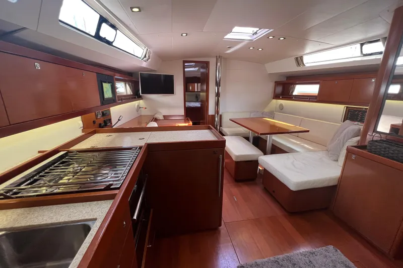 Slide: The Image of Luxurious interior of 2013 Beneteau Oceanis 45 yacht with modern kitchen and seating area. - 20