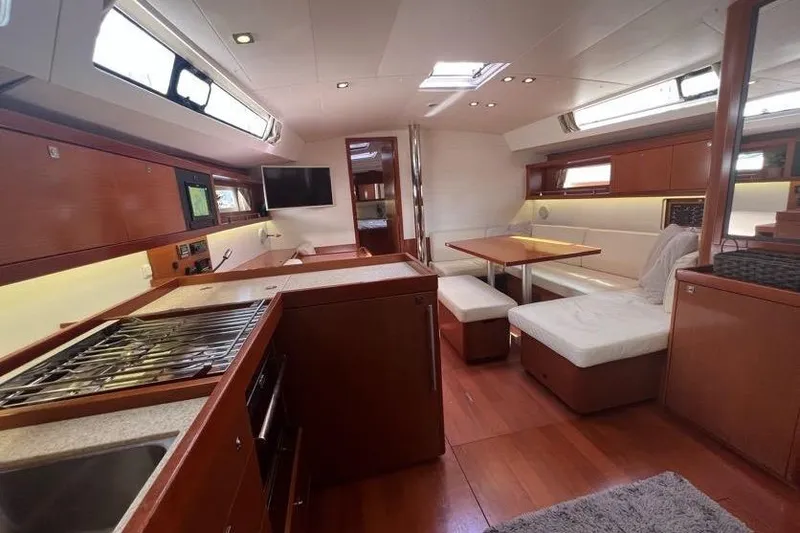 Slide: The Image of Luxurious interior of 2013 Beneteau Oceanis 45 yacht with modern kitchen and seating area. - 22