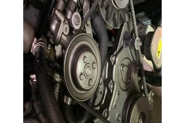 Slide: The Image of Engine components of a 2013 Beneteau Oceanis 45 sailboat, featuring pulleys and belts. - 35