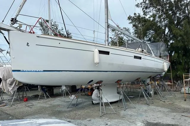 Slide: The Image of 2013 Beneteau Oceanis 45 sailboat on stands, undergoing maintenance in a boatyard. - 39