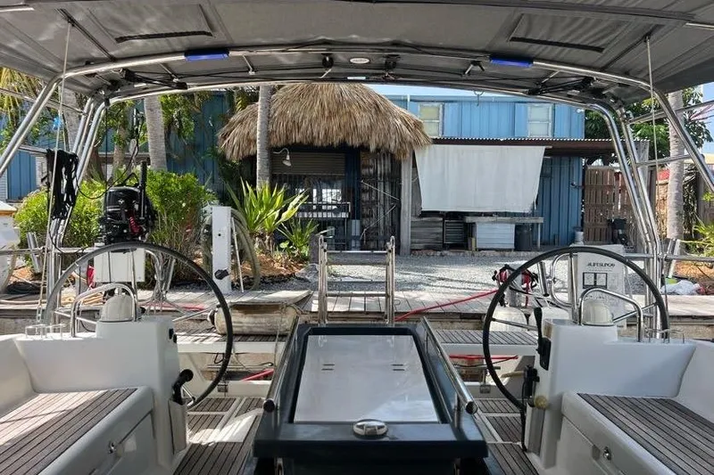 Slide: The Image of Cockpit view of 2013 Beneteau Oceanis 45 yacht docked near tropical hut. - 9