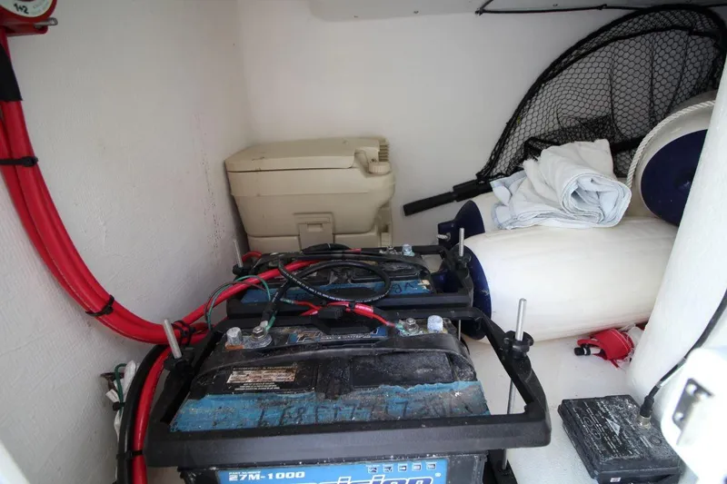 Slide: The Image of 2019 Judge 27 Chesapeake boat storage with battery, toilet, and fishing gear. - 22