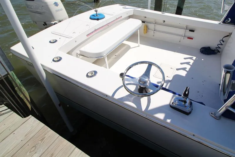 Slide: The Image of 2019 Judge 27 Chesapeake boat cockpit with steering wheel and controls. - 9