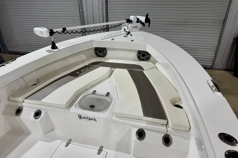 Slide: The Image of 2023 BlackJack 256 Coastal boat interior with seating and fishing equipment. - 10