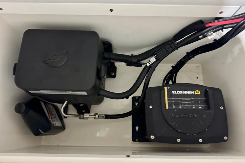 Slide: The Image of Electrical components inside a 2023 BlackJack 256 Coastal boat compartment. - 12