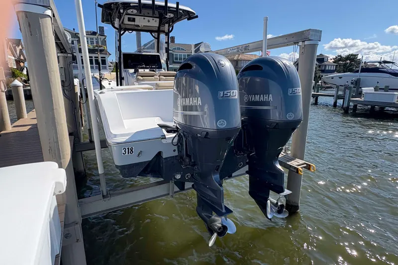 Slide: The Image of 2018 Sportsman Open 252 Center Console with twin Yamaha 150 engines docked. - 10