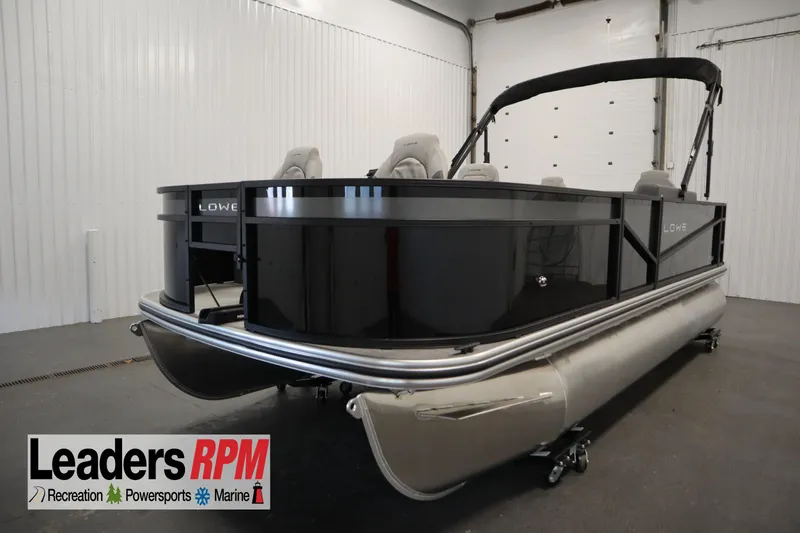 The Image of 2026 Lowe LF 194 pontoon boat in showroom, Leaders RPM logo visible. - 0
