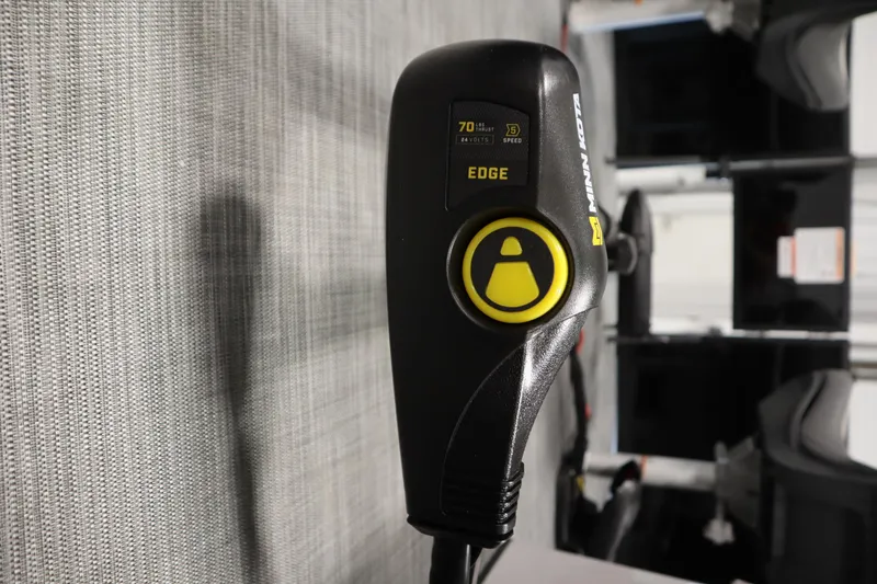 Slide: The Image of Close-up of a Minn Kota Edge trolling motor control handle, featuring speed settings. - 11
