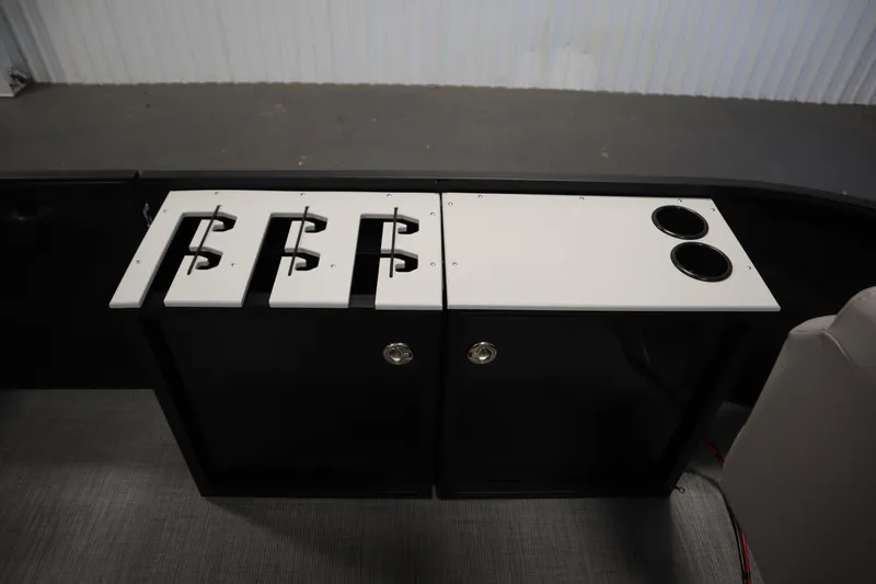 Slide: The Image of Lowe LF 194 boat interior with rod holders and cup holders, 2026 model. - 17