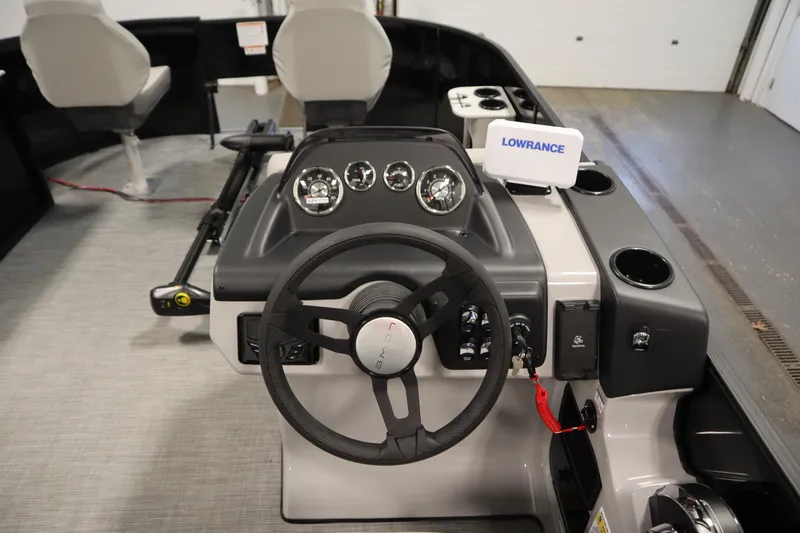 Slide: The Image of 2026 Lowe LF 194 boat dashboard with steering wheel and Lowrance navigation system. - 20