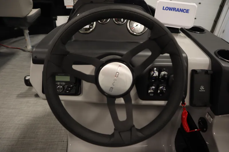 Slide: The Image of Steering wheel of 2026 Lowe LF 194 boat with dashboard controls and Lowrance display. - 21