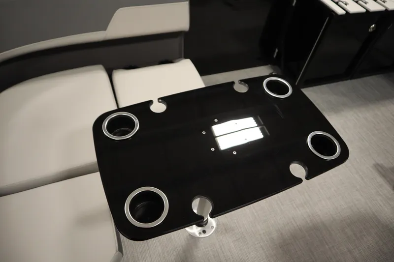 Slide: The Image of Modern boat interior with black table and cup holders, Lowe LF 194, 2026 model. - 34