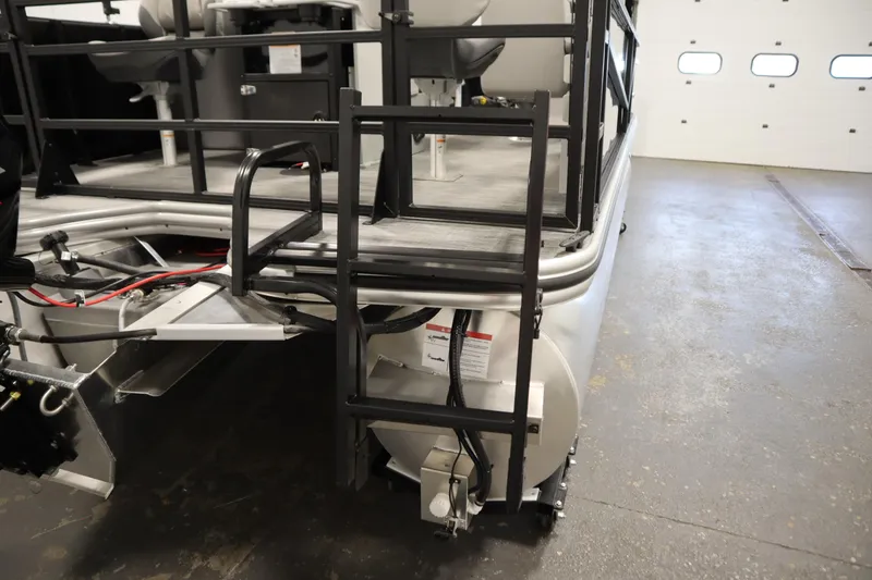 Slide: The Image of 2026 Lowe LF 194 boat ladder and deck in a garage setting. - 41