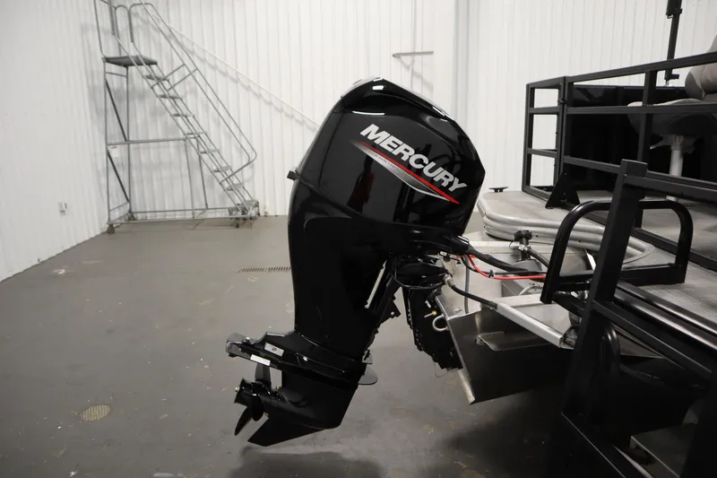 Slide: The Image of Lowe LF 194 boat with Mercury outboard motor in a garage, 2026 model. - 42