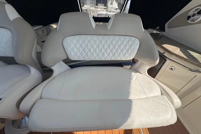 Slide: The Image of Luxury seating on 2011 Chaparral 330 Signature boat, featuring elegant white upholstery. - 10