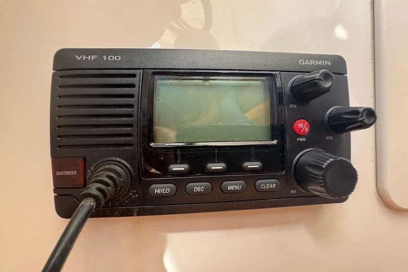 Slide: The Image of Garmin VHF 100 radio on 2011 Chaparral 330 Signature boat dashboard. - 16