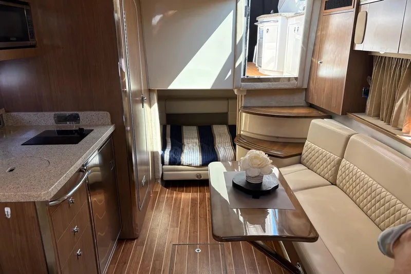 Slide: The Image of Luxurious interior of 2011 Chaparral 330 Signature yacht with kitchenette and seating area. - 17