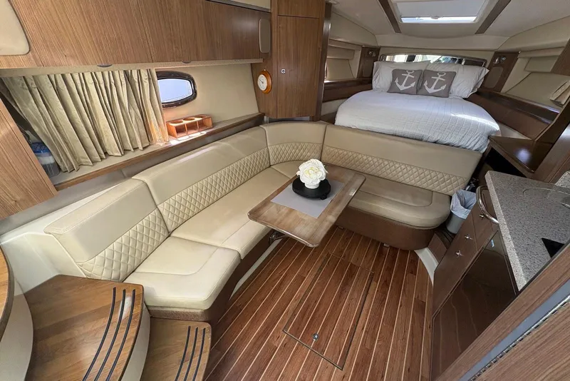 Slide: The Image of Luxurious interior of 2011 Chaparral 330 Signature yacht with elegant seating and cozy bed. - 18