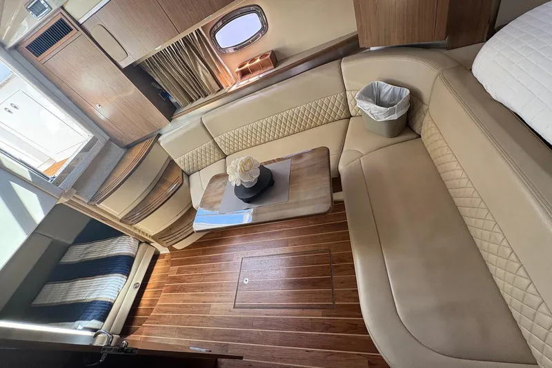 Slide: The Image of Luxurious interior of 2011 Chaparral 330 Signature yacht with elegant seating and wooden flooring. - 28