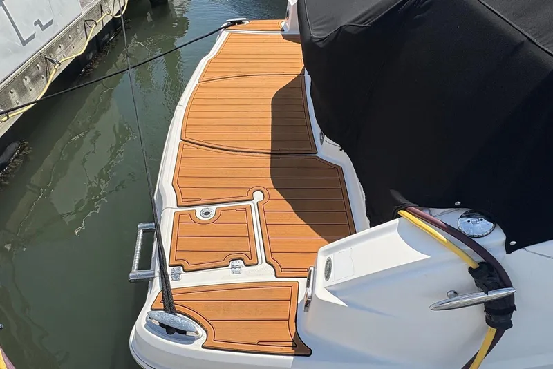 Slide: The Image of 2011 Chaparral 330 Signature boat with teak deck, docked at marina. - 3