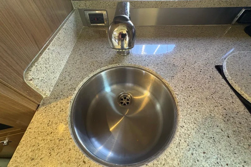 Slide: The Image of Stainless steel sink on Chaparral 330 Signature 2011 boat with granite countertop. - 34