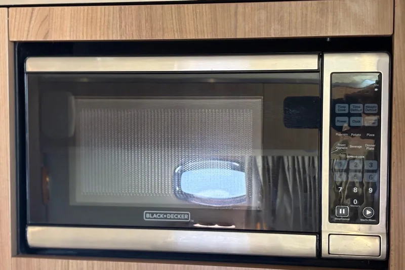 Slide: The Image of Black+Decker microwave in 2011 Chaparral 330 Signature boat kitchen. - 35