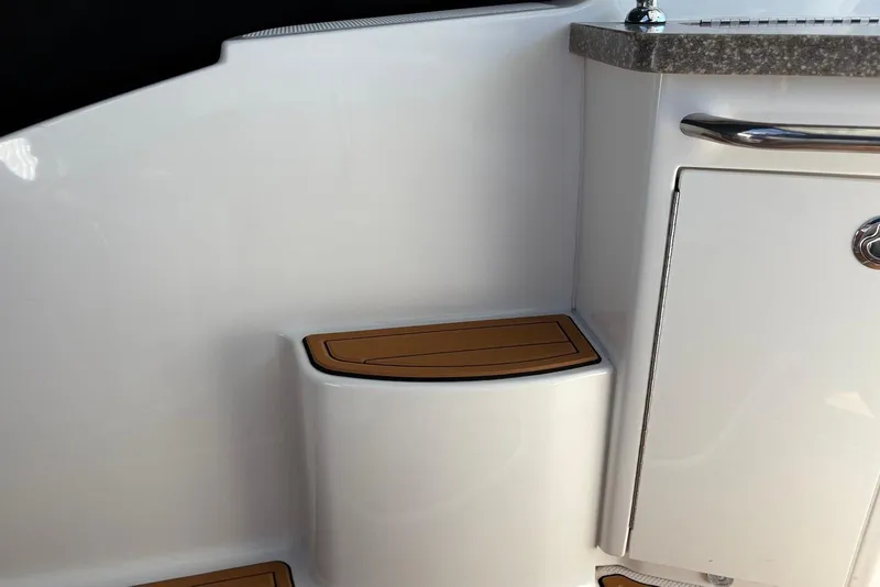 Slide: The Image of 2011 Chaparral 330 Signature boat interior with step and storage compartment. - 40