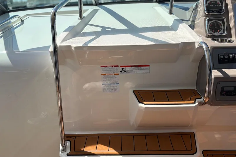 Slide: The Image of 2011 Chaparral 330 Signature boat interior with steps and control panel. - 41