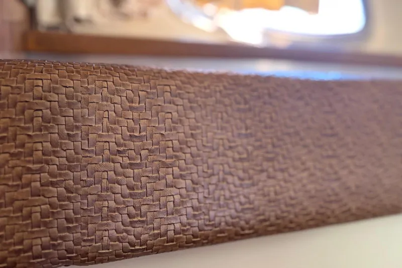 Slide: The Image of Close-up of textured brown surface on 2011 Chaparral 330 Signature boat interior. - 42