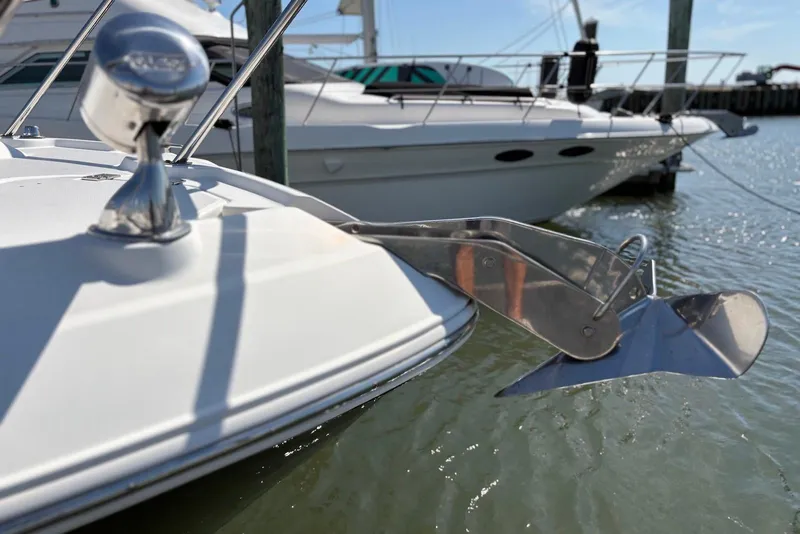 Slide: The Image of 2011 Chaparral 330 Signature boat with stainless steel anchor in marina. - 44