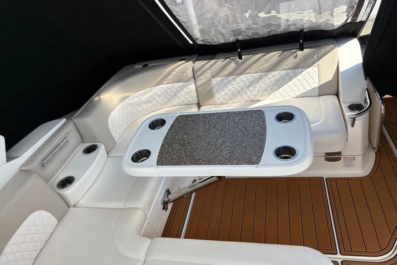 Slide: The Image of Luxurious seating area on 2011 Chaparral 330 Signature boat with table and cup holders. - 5