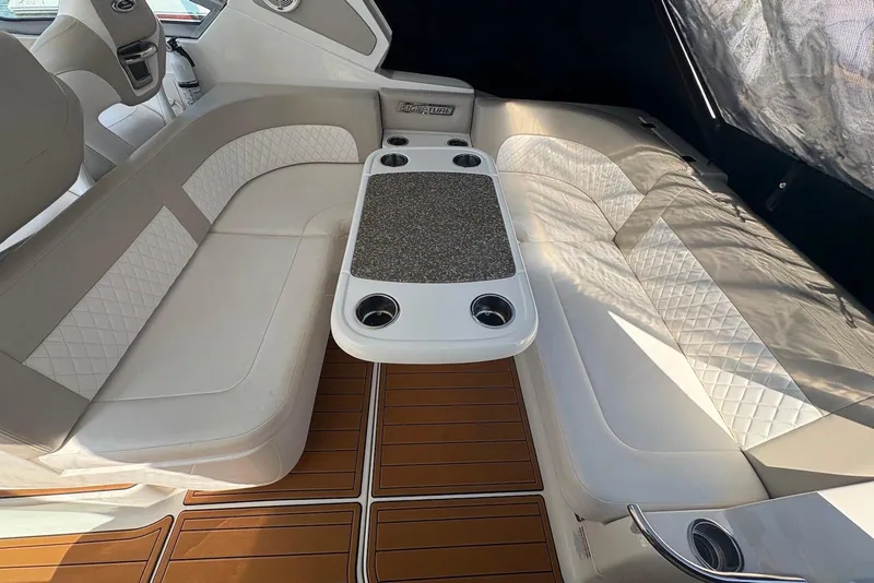 Slide: The Image of Luxurious seating area on a 2011 Chaparral 330 Signature boat with elegant upholstery. - 6