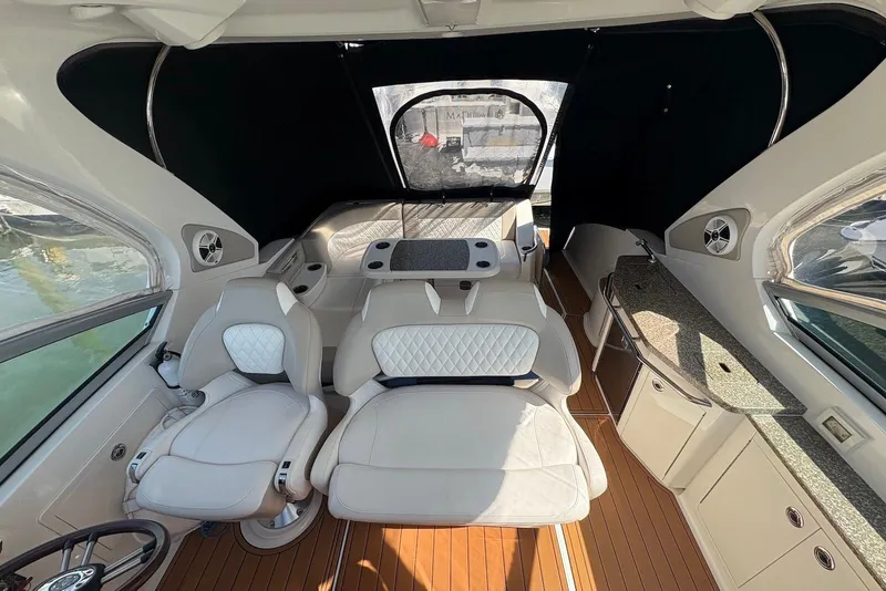 Slide: The Image of Interior of 2011 Chaparral 330 Signature boat with luxurious seating and modern amenities. - 8