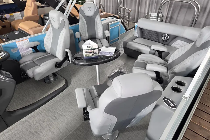 Slide: The Image of 2026 Godfrey Monaco 235 QSB boat interior with luxurious seating and modern design. - 11