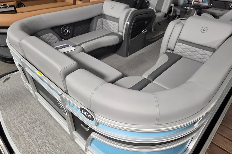 Slide: The Image of 2026 Godfrey Monaco 235 QSB pontoon boat with luxurious gray seating and modern design. - 7