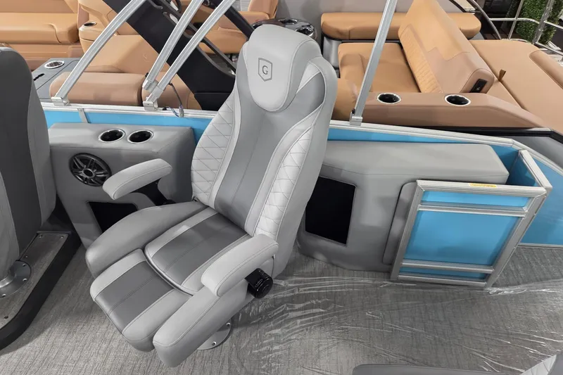Slide: The Image of Captain's chair on 2026 Godfrey Monaco 235 QSB pontoon boat, featuring luxurious seating. - 8