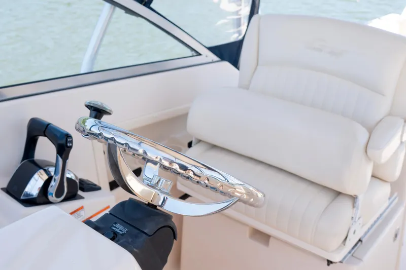 Slide: The Image of 2007 Grady-White Tournament 275 boat interior with steering wheel and seat. - 12