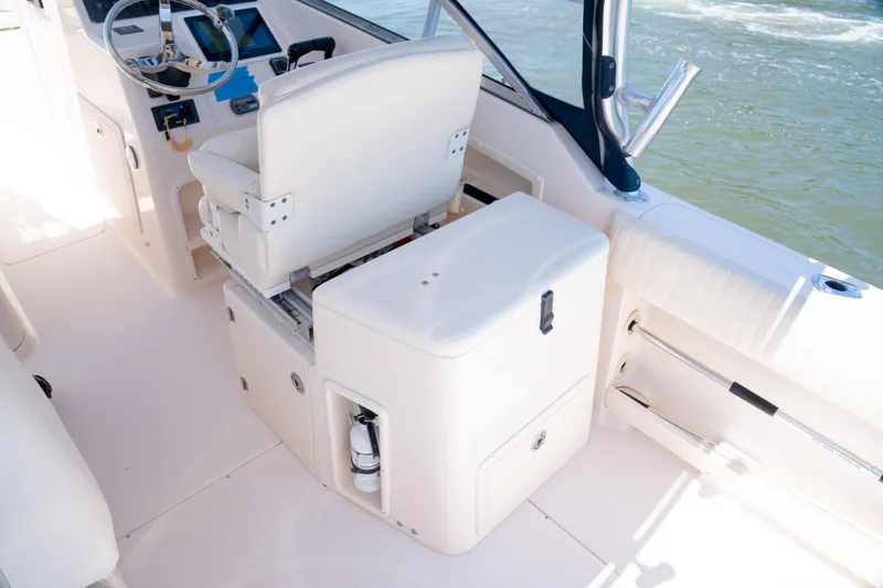 Slide: The Image of 2007 Grady-White Tournament 275 boat interior with helm and seating area. - 14