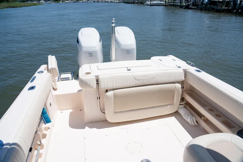 Slide: The Image of 2007 Grady-White Tournament 275 boat interior with dual engines on calm water. - 15