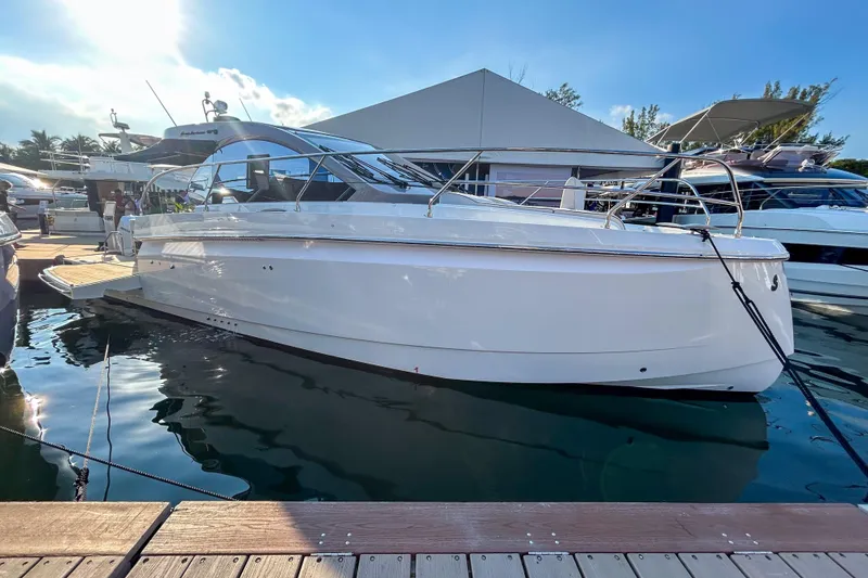 The Image of 2026 Beneteau Gran Turismo 40 yacht docked at marina under clear blue sky. - 0
